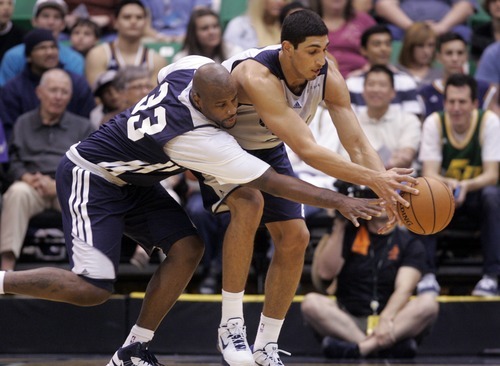 Kim Raff | The Salt Lake Tribune
Jazz players (left) Darnell Jackson and (right) Enes Kanter fight for a loose ball during the Jazz Scrimmage at EnergySolutions Arena in Salt Lake City, Utah on October 6, 2012.
