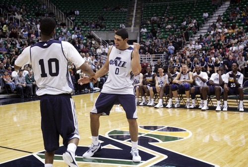 Kim Raff | The Salt Lake Tribune
(left) Jazz players Alec Burks and Enes Kanter dance on the court during introductions before the Jazz Scrimmage at EnergySolutions Arena in Salt Lake City, Utah on October 6, 2012.