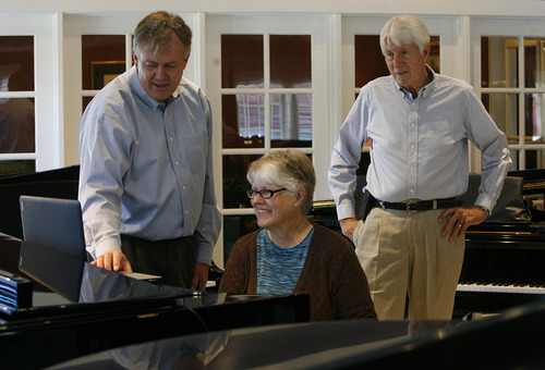Scott Sommerdorf  |  The Salt Lake Tribune             
Daynes vice president Kerwin Ipsen, left, works with customer Clara Neu as she tries out a computer that interfaces with one of the store's Steinways at Daynes Music Company in Midvale, Monday, October 1, 2012. Gerald 