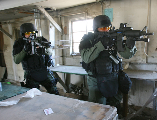 Steve Griffin | The Salt Lake Tribune
SWAT team members train in an empty building in Clearfield. The city has joined with Clinton, Syracuse and Layton's SWAT team to form a bigger group.