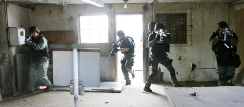 Steve Griffin | The Salt Lake Tribune
SWAT team members train in an empty building in Clearfield. The city has joined with Clinton, Syracuse and Layton's SWAT team to form a bigger group.