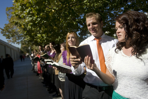 Kim Raff  |  The Salt Lake Tribune
Greg Powell and Kenna Kupfer sing hymns to people walking to conference during the 182nd Semiannual General Conference of the LDS Church in Salt Lake City on Sunday, October 7, 2012.