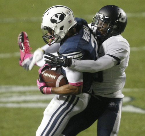 Chris Detrick  |  The Salt Lake Tribune
Brigham Young Cougars wide receiver Cody Hoffman (2) makes a catch past Utah State Aggies cornerback Rashard Stewart (6) during the first half of the game at LaVell Edwards Stadium Friday October 5, 2012. BYU is winning the game 6-3.