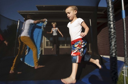 Leah Hogsten  |  The Salt Lake Tribune
Hagen Dickinson, 4, who suffers from moderate to severe autism, can run around the trampoline for hours, keeping himself entertained. But he needs constant supervision to prevent him from wandering away.