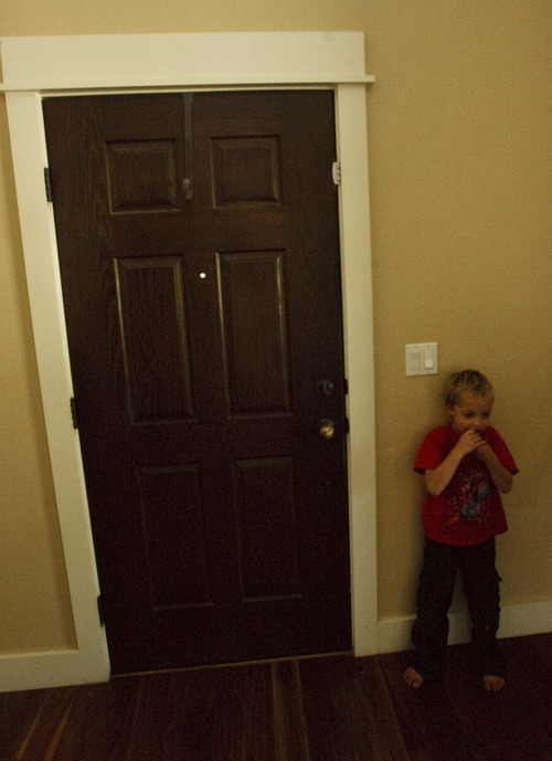 Leah Hogsten  |  The Salt Lake Tribune
Isaac Dickinson, 6, plays near the front door, which is equipped with a safety device to ensure that his autistic brother, Hagen, 4, cannot open it and wander off.