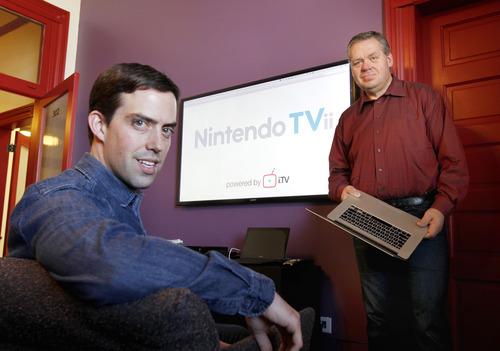 Al Hartmann  |  The Salt Lake Tribune
i.TV Co-founders  Justin Whittaker, left, and Brad Pelo in front of their big screen tv with the Nintendo TVii interface running on it.  i.TV is a  Provo software company that makes software for interactive television. They were hired by Nintendo to make the interactive television service called Nintendo TVii that will come with the upcoming Nintendo Wii U gaming console. It's a service in which you will be able to watch television on demand through your gaming console and also be able to interact with other people online while watching the tv.