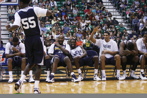 Kim Raff | The Salt Lake Tribune
Kevin Murphy's teammates cheer him on as he dances during a Jazz Scrimmage at EnergySolutions Arena in Salt Lake City on Oct. 6, 2012.