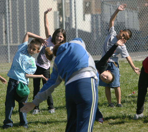 Steve Griffin | The Salt Lake Tribune


Third-graders at Westbrook Elementary School stretch before they run as part of Westbrook PTA's third annual 