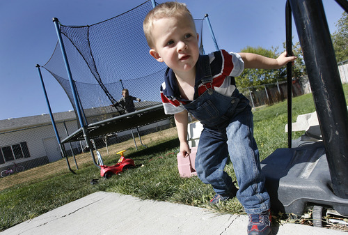 Scott Sommerdorf  |  The Salt Lake Tribune             
Damien Cook plays in his backyard in Tremonton, Monday, October 1, 2012. The 3-year-old is among more than 260 Utah children with autism cuing up for limited spots in a free treatment program.