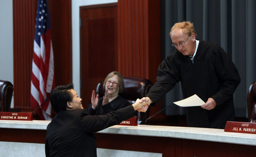 Francisco Kjolseth  |  The Salt Lake Tribune
Su Chon is congratulated by Justice Ronald E. Nehring after swearing her in as Utah's newest judge in the Utah Supreme Court at the Matheson Courthouse in Salt Lake City on Tuesday, October 9, 2012. Chon stirred controversy earlier this year by becoming the first judicial nominee in memory to fail to receive a favorable appointment from a Senate confirmation committee.