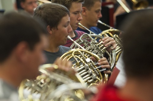 Chris Detrick  |  The Salt Lake Tribune
Members of the Wind Symphony perform during a rehearsal at American Fork High School Wednesday Oct. 10, 2012. The symphony, along with the University of Utah Wind Ensemble, will perform a special concert in honor of Heather Christensen on Oct. 23 on the university's campus.