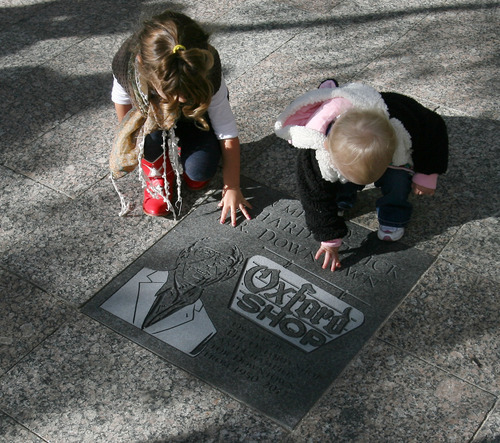 Steve Griffin | The Salt Lake Tribune

Nevaeh Wirick, 3, and Olivia Jean Bruno-Wirick, 16 months, touch the memorial for their great-grandfather, Richard Wirick, following an unveiling of the memorial on Gallivan Plaza in Salt Lake City on Thursday October 11, 2012. The permanent memorial is located in the heart of the city he helped promote. He had a vision of 