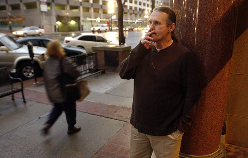 Bruce Dallas Goodman enjoys a smoke on his first day of freedom outside of his attorney's office in downtown Salt Lake on Tuesday after serving 19 years for a murder conviction vacated by new DNA evidence.     Photo by Francisco Kjolseth/The Salt Lake Tribune 11/09/2004