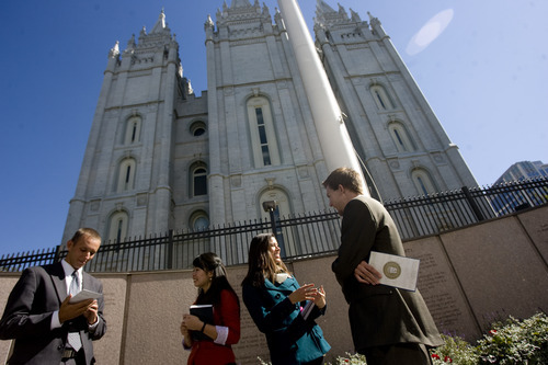 Kim Raff  |  The Salt Lake Tribune
Missionaries Sister Khanitta Puttapong and Sister Christina Wong talk to Casey Ahlstrom, left, and Jason Mondon in Temple Square during the 182nd Semiannual General Conference of the LDS Church in Salt Lake City on Sunday,  October 7, 2012.