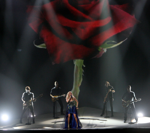 Steve Griffin | The Salt Lake Tribune


Carrie Underwood sings as as a rose is projected on a giant screen during her Blown Away Tour stop at the Maverick Center in West Valley City on Wednesday, Oct. 10, 2012.