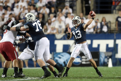 Chris Detrick  |  The Salt Lake Tribune
Brigham Young Cougars quarterback Riley Nelson (13) throws the ball during the first half of the game against Washington State at LaVell Edwards Stadium Thursday August 30, 2012. BYU is winning the game 24-6.