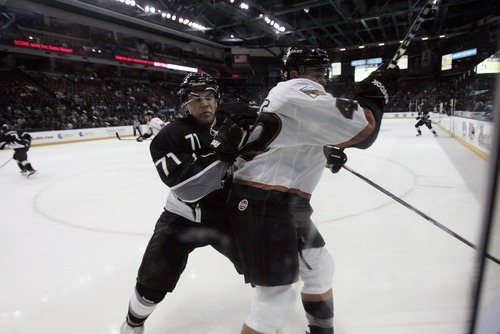 Kim Raff | The Salt Lake Tribune
Utah Grizzlies player (right) Evan Stollet is pushed into the boards by Idaho Steelheads player Corey Tamblyn during the Grizzlies home opener at the Maverick Center in West Valley City, Utah on October 13, 2012.