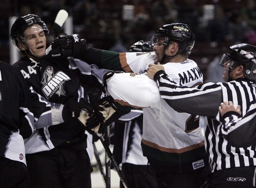 Kim Raff | The Salt Lake Tribune
(right) Utah Grizzlies player Tommy Maxwell fights with Idaho Steelheads player Scott Todd during the Grizzlies' home opener at the Maverick Center in West Valley City, Utah on October 13, 2012.