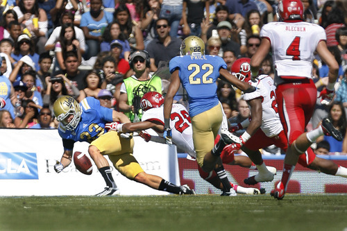 Scott Sommerdorf  |  The Salt Lake Tribune             
UCLA Bruins running back Steven Manfro (33) fumbles a punt into the end zone where Utah Utes defensive back Ryan Lacy (26) recovered for the Utes first TD, tying the score at 7-7. UCLA defeated Utah 21-14 in Pasadena, Saturday, October 13, 2012.