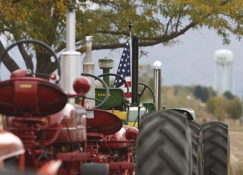 Leah Hogsten  |  The Salt Lake Tribune
Members of the Great Basin Antique Machinery Branch 95 parade their antique tractors throughout West Haven on their annual fun run Saturday, October 13, 2012 in West Haven.