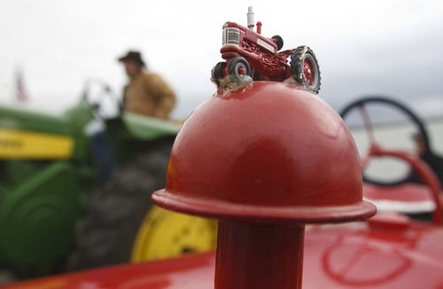 Leah Hogsten  |  The Salt Lake Tribune
Margaret Brimhall's International Harvester sports a miniature version of itself atop her tractor Saturday, October 13, 2012. Members of the Great Basin Antique Machinery Branch 95 paraded their antique tractors throughout West Haven on their annual fun run Saturday, October 13, 2012 in West Haven.
