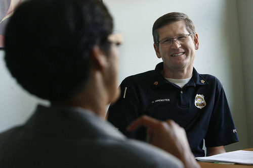 Scott Sommerdorf  |  The Salt Lake Tribune             
SLCPD Sgt. Dan Brewster speaks with Asha Parekh at the YWCA center at 310 E. 300 South in Salt Lake City. The YWCA announced a new $900K grant to help pay for more police and prosecutor time to combat domestic violence, Monday, October 15, 2012.