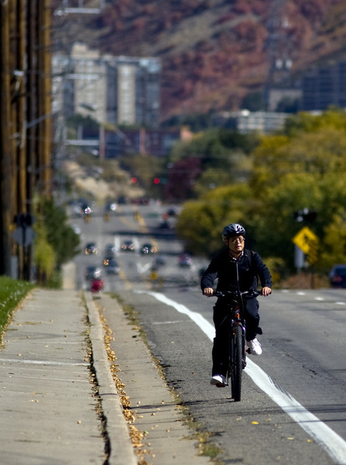 Kim Raff  |  The Salt Lake Tribune
A bike rider travels on Sunnyside Avenue toward Guardsman Way in Salt Lake City on Sunday, October 14, 2012. In January, Mayor Ralph Becker, as part of his 