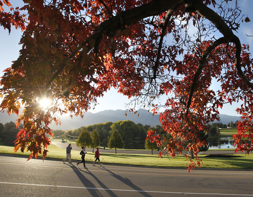 Al Hartmann  |  The Salt Lake Tribune
Long shadows follow runners in Sugarhouse Park in Salt Lake City as the sun rises above the peaks of the Wasatch Mountains on Monday, Oct. 15. Autumn colors have begun to make their appearance in the Salt Lake Valley.