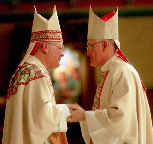 Tribune file photo
Newly ordained Salt Lake Bishop George H. Niederauer, left, is greeted in January 1995 by his predecessor, Bishop William K. Weigand, who went on to serve California's Diocese of Sacramento.