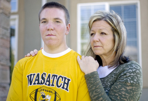 Kim Raff | The Salt Lake Tribune
Koen Hyde sustained a severe concussion during wrestling season last spring that has kept him on the sidelines this football season.  After sustaining the concussion he didn't recognize his mother, (right) Rebecca Hyde.  They are pictured outside their home in Heber on Sept. 7, 2012.