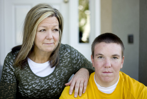 Kim Raff | The Salt Lake Tribune
Koen Hyde sustained a severe concussion during wrestling season last spring that has kept him on the sidelines this football season.  After sustaining the concussion he didn't recognize his mother, (left) Rebecca Hyde.  They are pictured outside their home in Heber on Sept. 7, 2012.