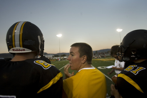 Kim Raff | The Salt Lake Tribune
Koen Hyde sustained a severe concussion during wrestling season last spring that has kept him on the sidelines this football season. Hyde stands on the sidelines and watches the Wasatch High School varsity football team play a home game against Juab in Heber on Sept. 7, 2012.