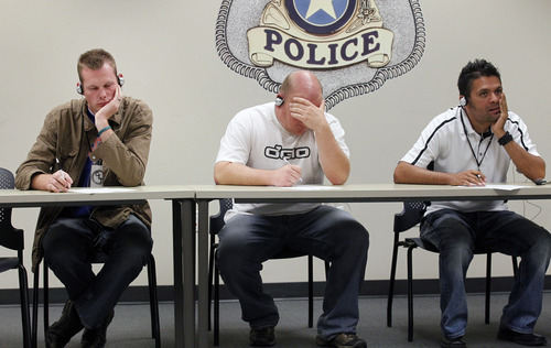 Al Hartmann  |  The Salt Lake Tribune
Law enforcement officers listen to simulated sounds (voices) of what mentally ill people might hear in everyday life and try to recall and write down details in a memorization exercise. The training on Thursday was part of a weeklong Crisis Intervention Team (CIT) education program designed to help officers gain an understanding and empathy when they deal with the mentally ill in the course of their jobs.