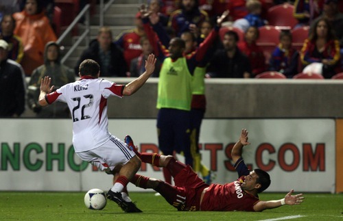 Kim Raff | The Salt Lake Tribune
(right) Real Salt Lake player Javier Morales #11 is fouled by D.C. United player Chris Korb during a game at Rio Tinto Stadium in Sandy, Utah on September 1, 2012.  Real Salt Lake went on to win the game 1-0.