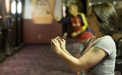 Keith Johnson | The Salt Lake Tribune
Angela Pardee and Tom Booms play darts at Club DJ's in Taylorsville. The club also features karaoke and pool.