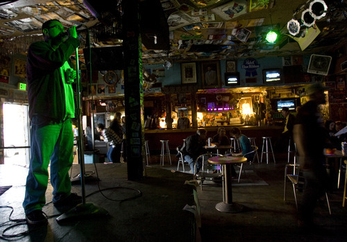 Kim Raff | The Salt Lake Tribune
Jeff Michael Vice sings during a Karaoke for the Cure fundraiser on Metastatic Breast Cancer Awareness Day at Burt's Tiki Lounge in Salt Lake City. The event was organized by Beverly Brehl, a 35-year-old mother who has metastatic breast cancer.