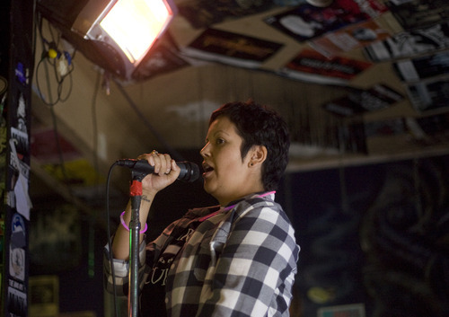 Kim Raff | The Salt Lake Tribune
Beverly Brehl talks about cancer research during her Karaoke for the Cure fundraiser on Metastatic Breast Cancer Awareness Day at Burt's Tiki Lounge in Salt Lake City. The event was organized by Brehl, who has metastatic breast cancer.