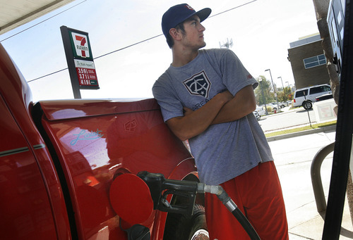 Scott Sommerdorf  |  The Salt Lake Tribune              
Tanner Draper fills up at 7-Eleven at 2666 W. 7800 South in West Jordan, Friday, October 19, 2012. Gas prices are down about 8 cents a gallon in the past month in Utah, and down nationally, as well. Two stations, the Phillips 66 at 8370 S. State in Midvale, and the 7-Eleven on 7800 South, are among the lowest in the valley, with prices below $3.60.