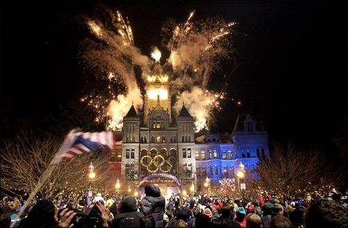 Tribune file photo
Thousands of fans reveled while fireworks exploded above the City and County Building in 2002 to welcome the Olympic torch relay to Salt Lake City, while giant portraits of athletes graced the sides of downtown buildings and helped create a festive atmosphere.