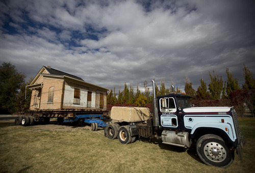 Lennie Mahler  |  The Salt Lake Tribune
A truck pulls the Casto home into its new loaction in the City Hall Park on Saturday, Oct. 20, 2012.