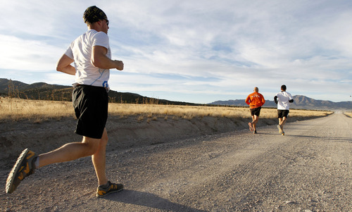 Al Hartmann  |  The Salt Lake Tribune
Competetive-elite runners run comfortably at mile 6 during the Pony Express Trail 100 Endurance Run Friday, Oct. 19. Some 75 entrants and their support teams will run the 50-mile course or the 100-mile course along the historic Pony Express route in the west desert areas of Tooele and Juab counties.