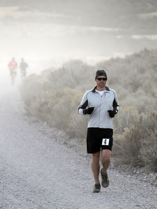 Al Hartmann  |  The Salt Lake Tribune
Runner Brian Janeck of Portland, Ore., eats some dust during  the Pony Express Trail 100 Endurance Run Friday, Oct. 19. Some 75 entrants and their support teams will run the 50-mile course or the 100-mile course along the historic Pony Express route in the west desert areas of Tooele and Juab counties.