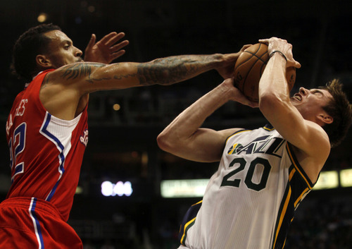 Ashley Detrick  |  The Salt Lake Tribune
Matt Barnes (22) takes the ball from Gordon Hayward in the second half of the game against the Clippers on Saturday, Oct. 20, 2012 at Energy Solutions in Salt Lake City. The Jazz beat the Clippers, 99-91.