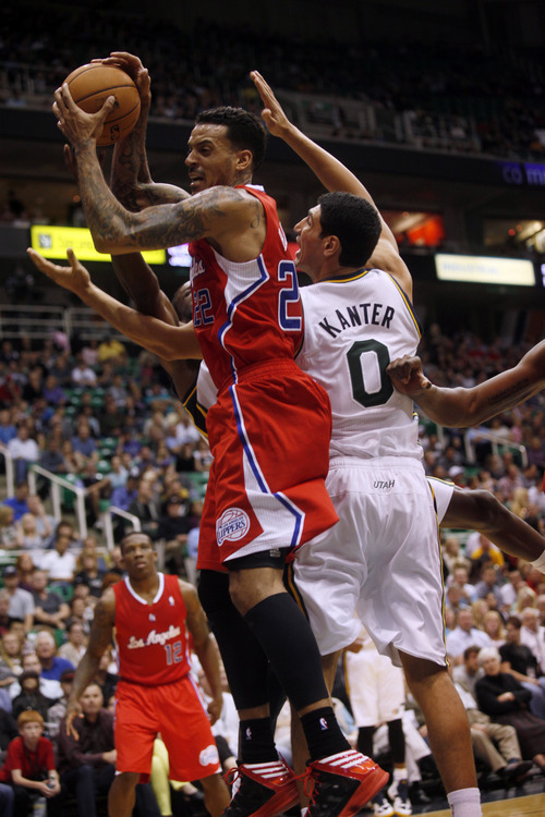 Ashley Detrick  |  The Salt Lake Tribune
Matt Barnes of the Clippers takes down a rebound from the Jazz's Enes Kanter in the second half of the game against the Clippers on Saturday, Oct. 20, 2012 at Energy Solutions in Salt Lake City. The Jazz beat the Clippers, 99-91.