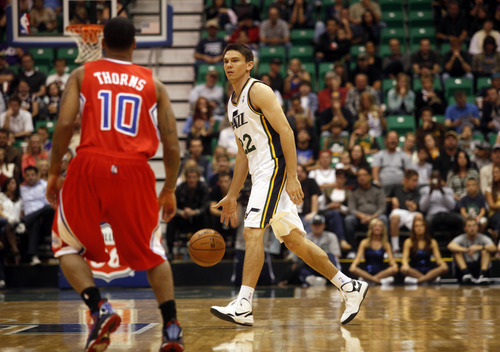 Ashley Detrick  |  The Salt Lake Tribune
Chris Quinn looks for a pass down court during the second half of the game against the Clippers on Saturday, Oct. 20, 2012 at Energy Solutions in Salt Lake City. The Jazz beat the Clippers, 99-91.