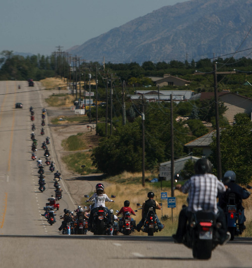 Trent Nelson  |  The Salt Lake Tribune
Jen Comer joins a July motorcycle ride in Ogden to raise money for Weber County Sheriff Terry Thompson and Cache County Sheriff G. Lynn Nelson.