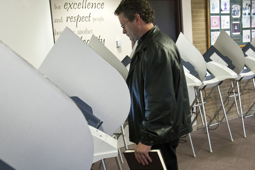 Chris Detrick  |  The Salt Lake Tribune
Ryan Robinson, of Magna, votes early at the Salt Lake County Government Center on Tuesday. Early voting runs through Nov. 2. Election Day is Nov. 6.