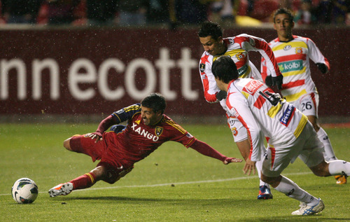 Steve Griffin | The Salt Lake Tribune


Real Salt Lake's Javier Morales slides as he tries to kick the ball around the C.S. Herediano defense during first half action of the their CONCACAF match at Rio TInto Stadium in Sandy, Utah Tuesday October 23, 2012.