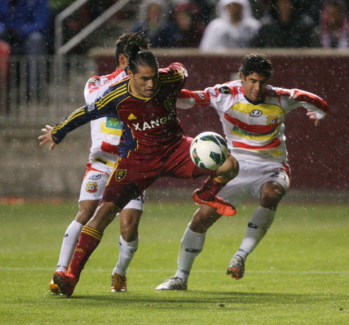 Steve Griffin | The Salt Lake Tribune


Real Salt Lake's Fabian Espindola gets past the C.S. Herediano defense during first half action of the their CONCACAF match at Rio TInto Stadium in Sandy, Utah Tuesday October 23, 2012.