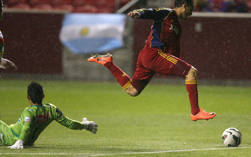 Steve Griffin | The Salt Lake Tribune


Real Salt Lake's Fabian Espindola leaps over C.S. Herediano goal keeper Leo Moreira as he chases down the ball during first half action of the their CONCACAF match at Rio TInto Stadium in Sandy, Utah Tuesday October 23, 2012.